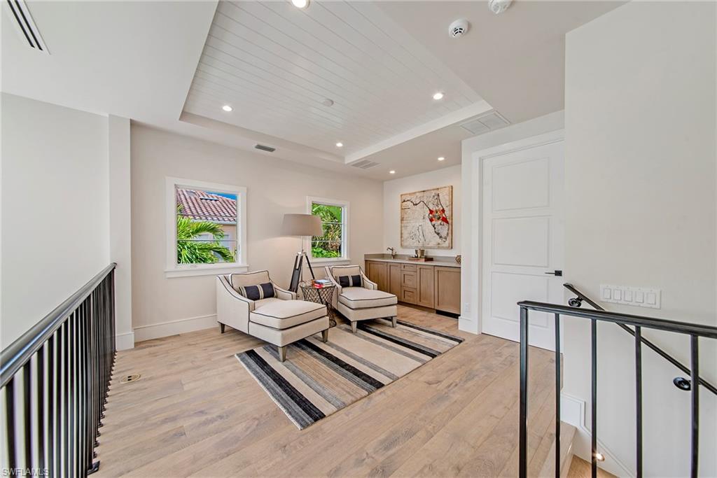 434 3rd Avenue South Naples, FL 34102 - Photo 6 of 24 a living room with furniture and a table