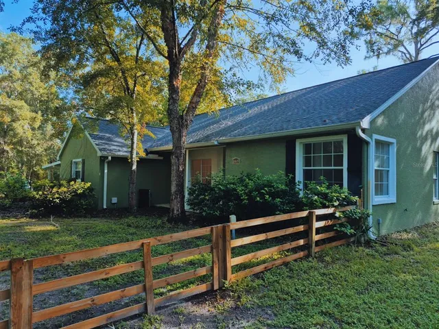 a house view with a garden space