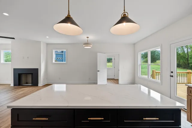 a view of kitchen with furniture and a chandelier