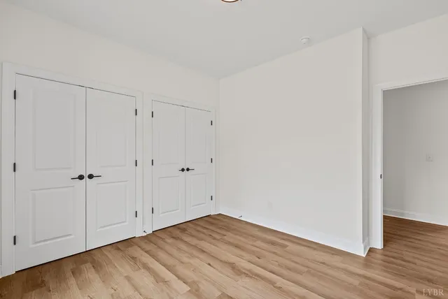 a view of room with wooden floor