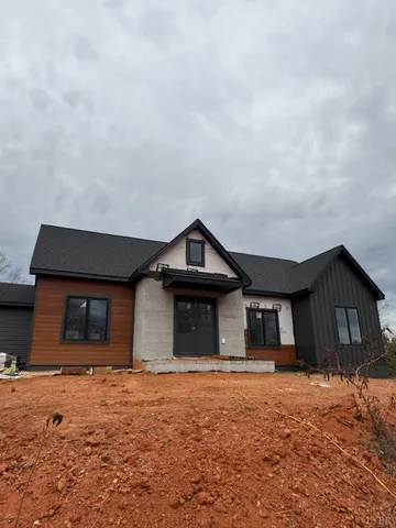 a house with trees in the background