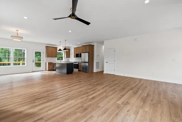 a view of a kitchen with a sink and a window