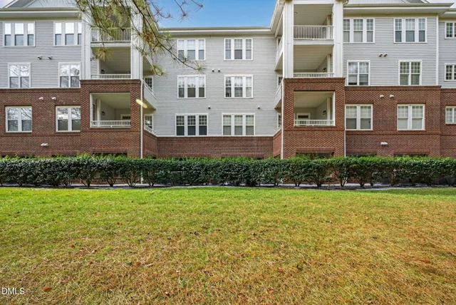 a view of a building with a yard