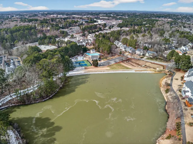 an aerial view of a house with a lake view