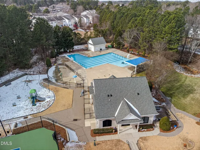 an aerial view of a house with outdoor space