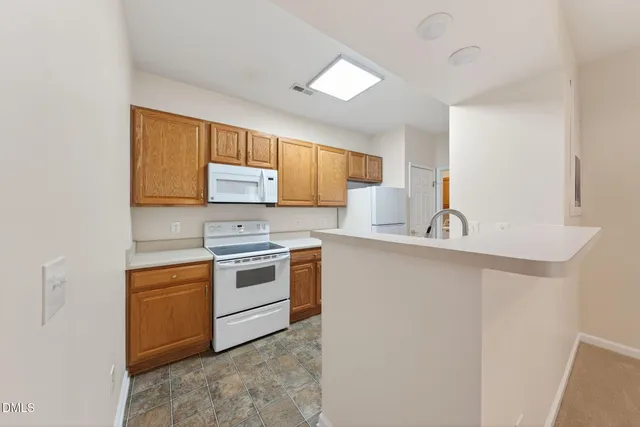 a view of a livingroom with a ceiling fan and window