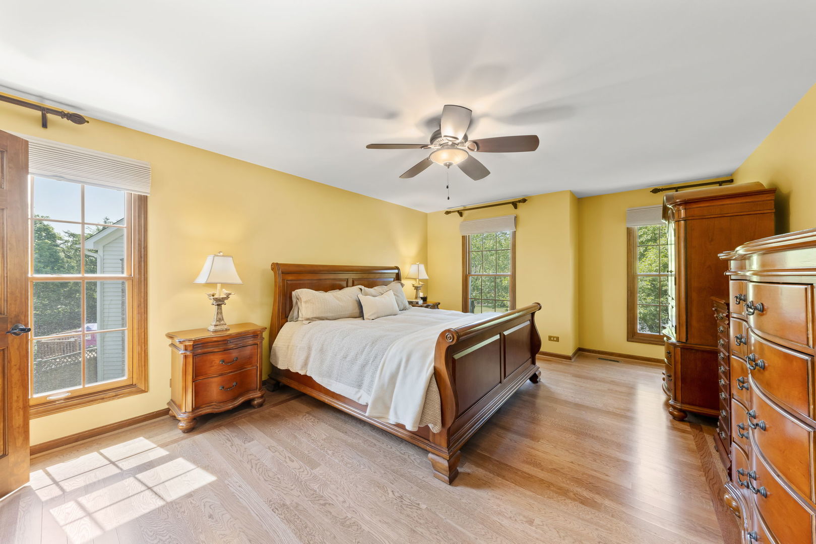 1921 Hampton Drive Wheaton, IL 60189 - Photo 20 of 54 a spacious bedroom with a bed and a chandelier