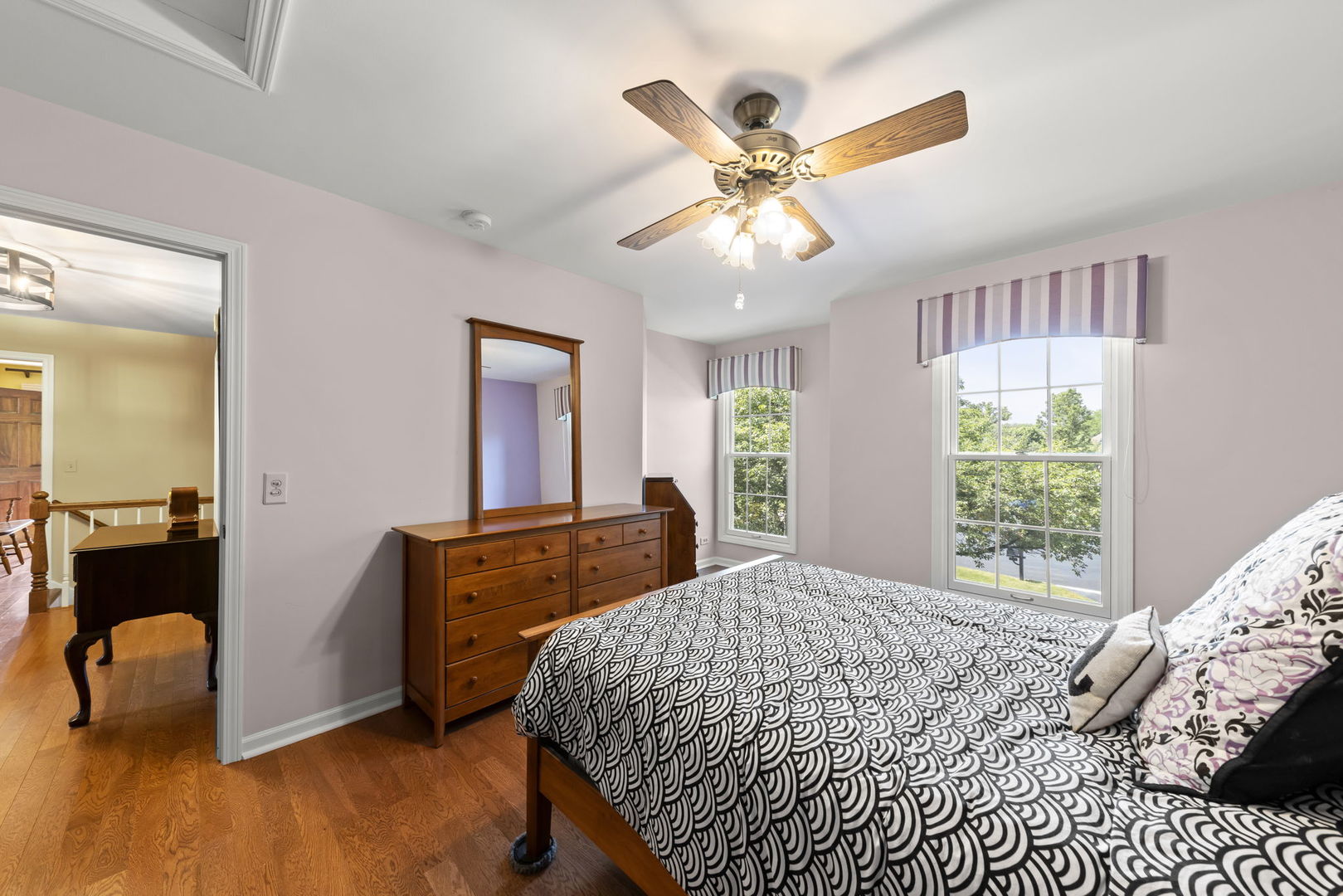 1921 Hampton Drive Wheaton, IL 60189 - Photo 26 of 54 a bedroom with a bed and a chandelier