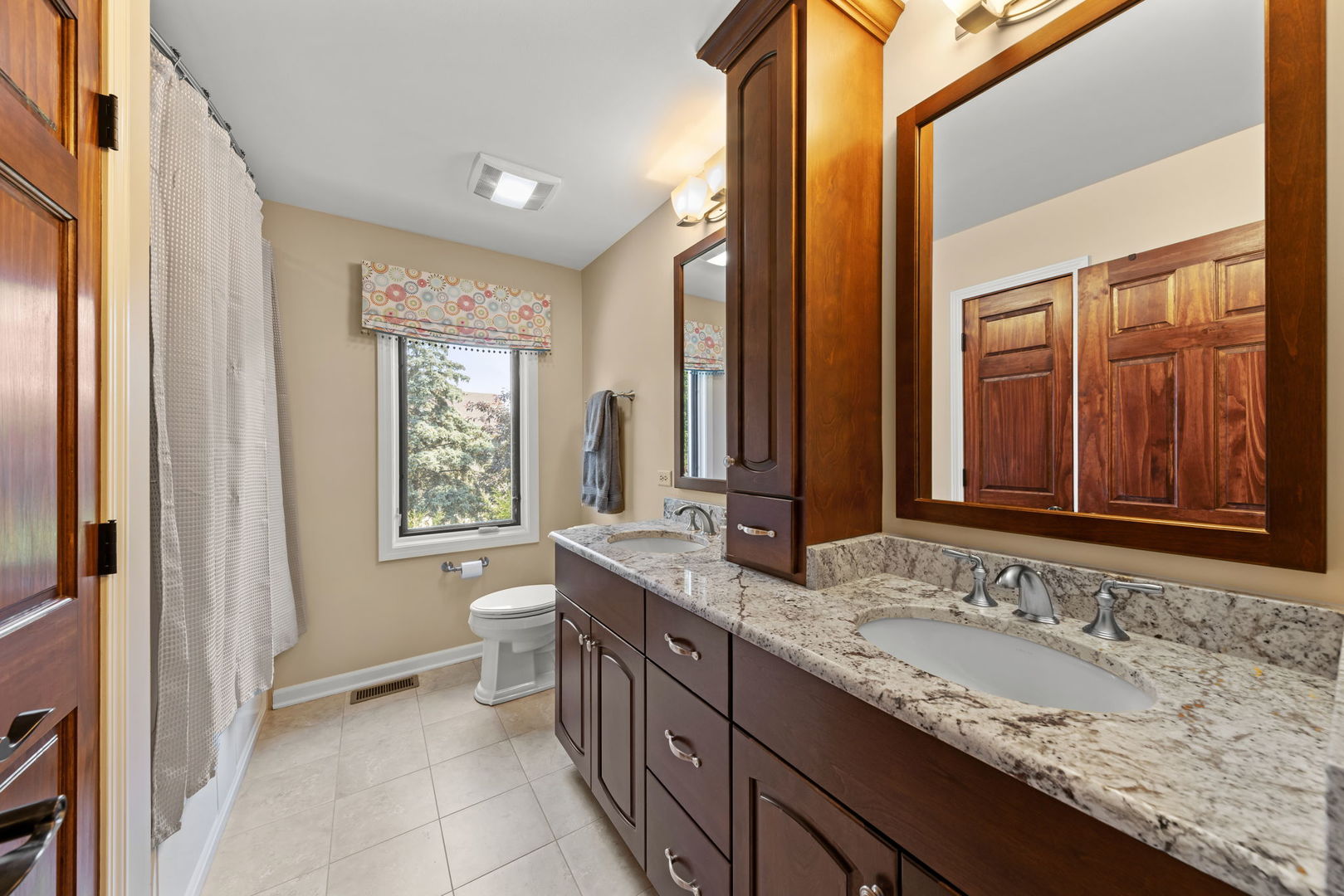 1921 Hampton Drive Wheaton, IL 60189 - Photo 28 of 54 a bathroom with a granite countertop sink and a mirror