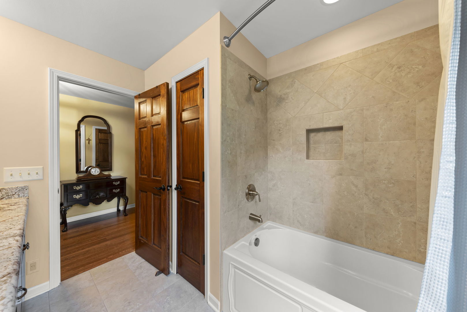 1921 Hampton Drive Wheaton, IL 60189 - Photo 29 of 54 a bathroom with a tub a mirror and shower