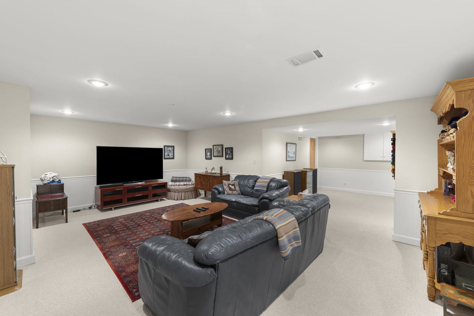 1921 Hampton Drive Wheaton, IL 60189 - Photo 30 of 54 a living room with furniture and a flat screen tv