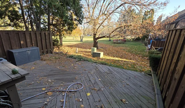 a view of a backyard with wooden floor