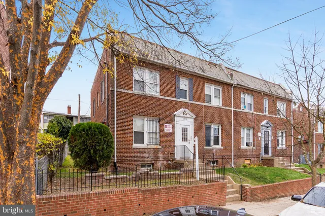 a front view of a building with garden