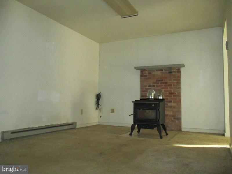 9357 Jamesons Mill Road Rixeyville, VA 22737 - Photo 8 of 12 a room with a chair and a table