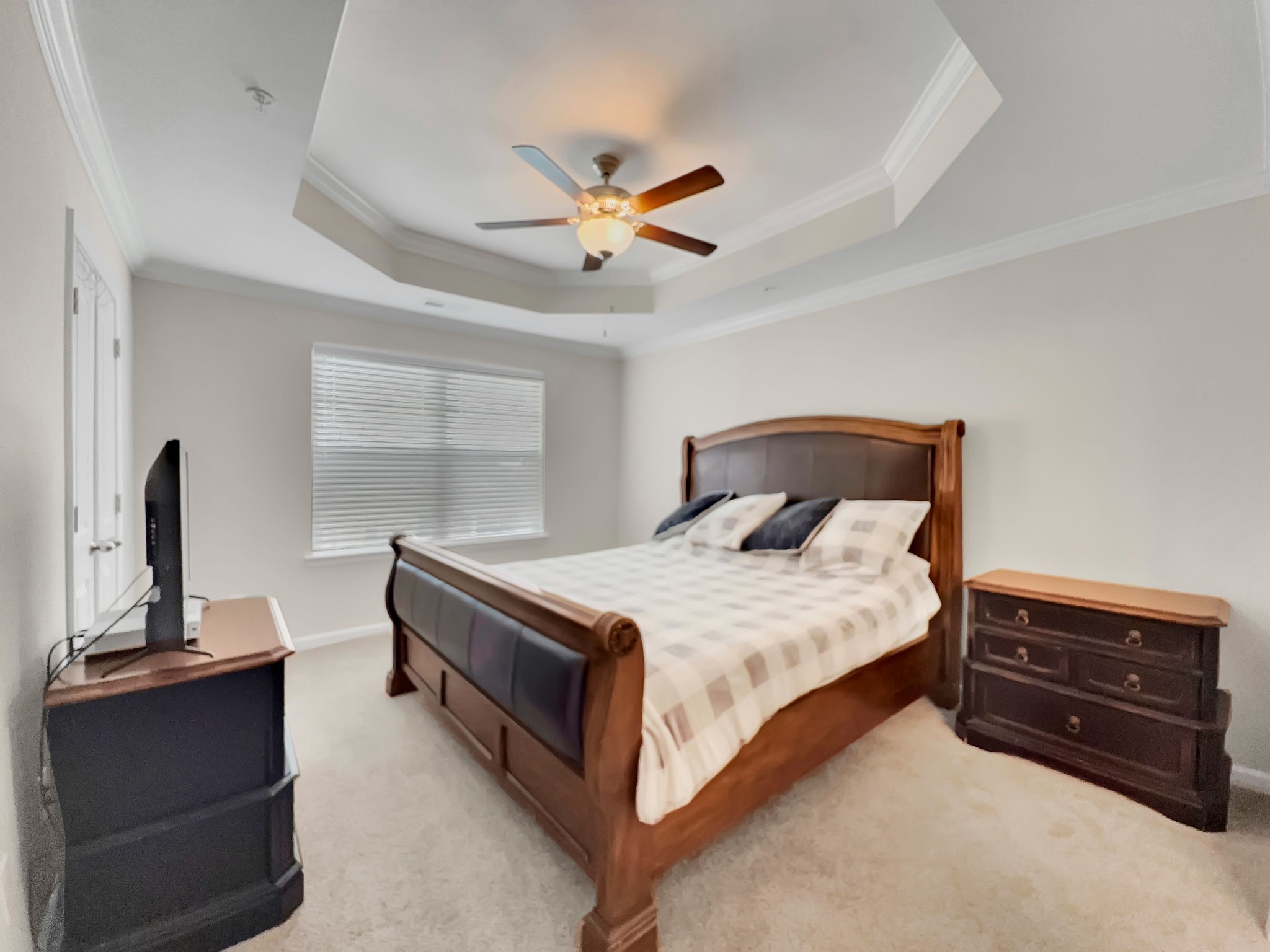 147 Addi Street Pleasant View, TN 37146 - Photo 13 of 27 a bedroom with a bed and a flat tv screen on the dresser