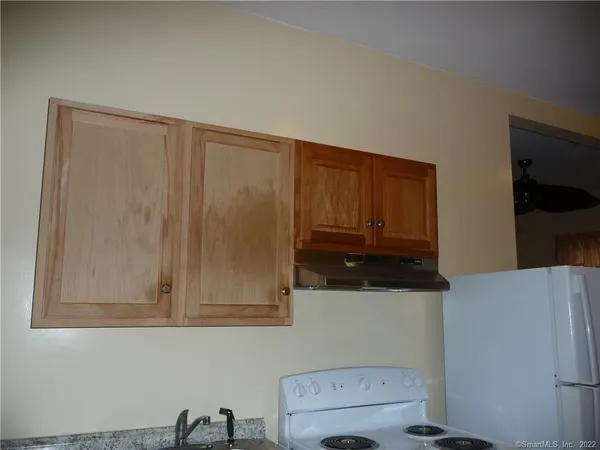 a view of cabinets and wooden floor