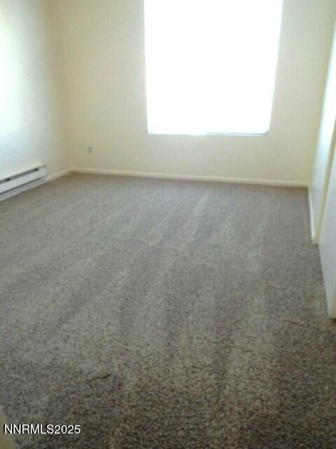 3952 Clear Acre Lane, Unit 275 Reno, NV 89512 - Photo 14 of 16 a view of an empty room and a window