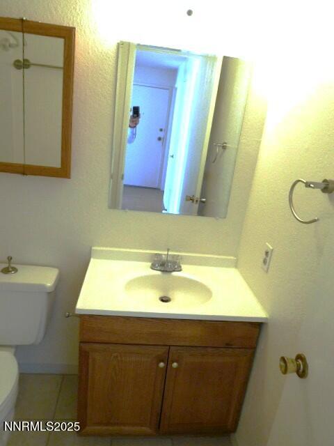 3952 Clear Acre Lane, Unit 275 Reno, NV 89512 - Photo 4 of 16 a bathroom with a sink and a mirror