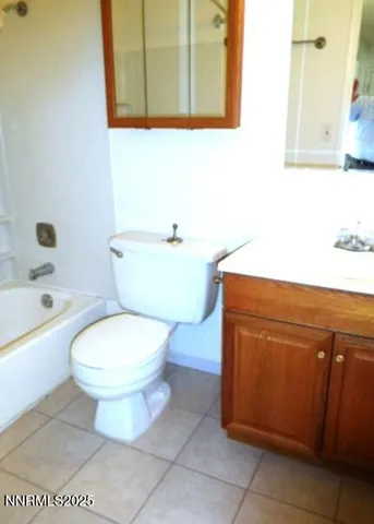 a bathroom with a toilet a sink and bathtub