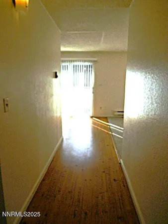 a view of a big room with wooden floor
