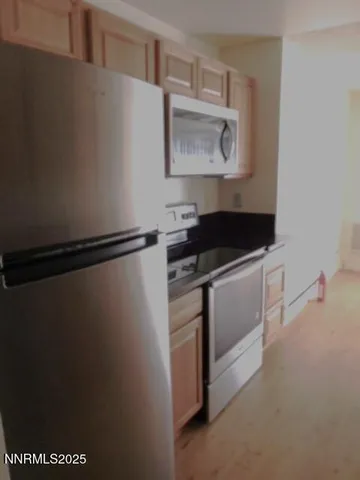 a utility room with sink dryer and washer