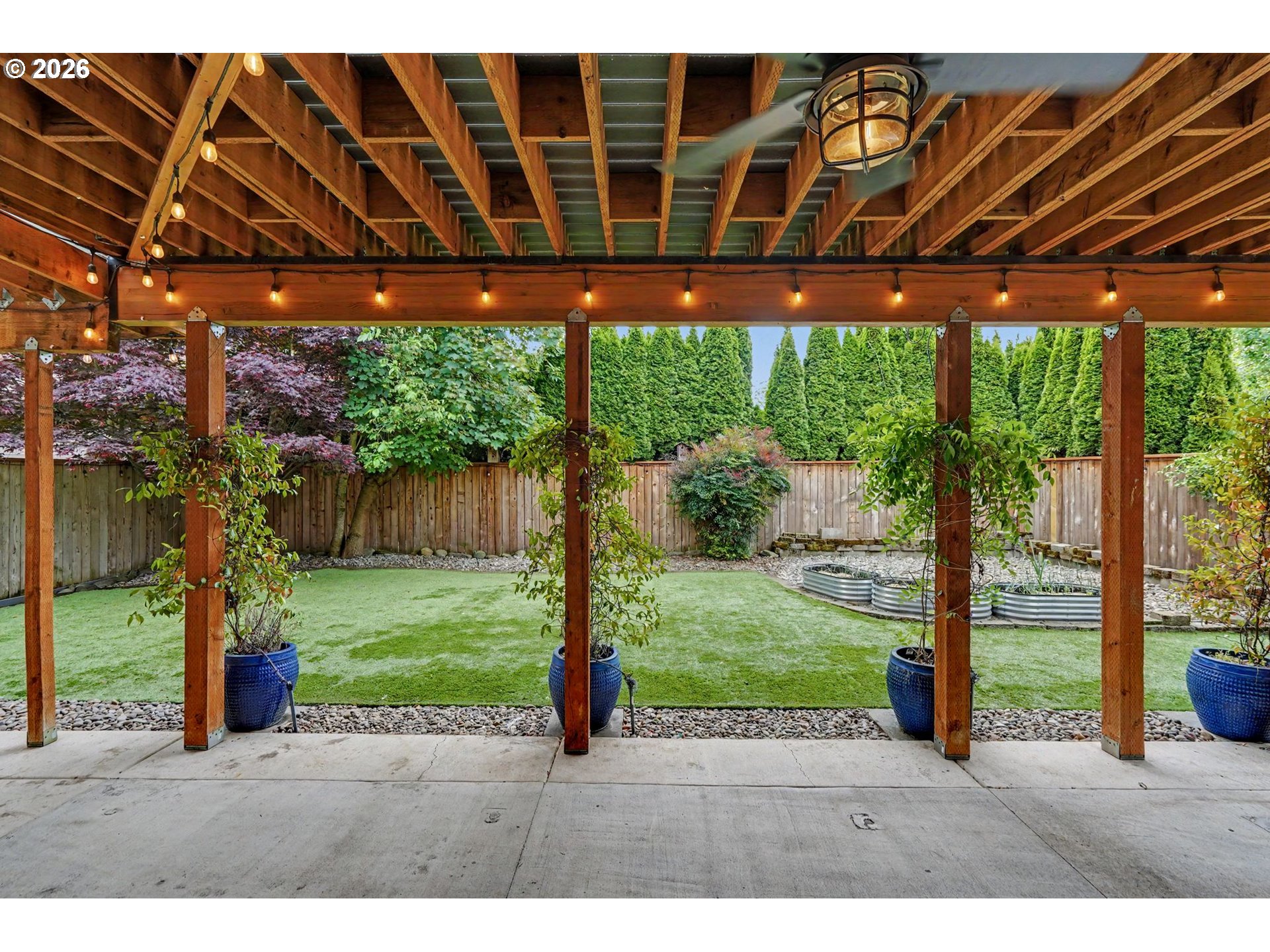 1462 Barnick Road Northeast Keizer, OR 97303 - Photo 43 of 48 a backyard of a house with a garden and outdoor seating