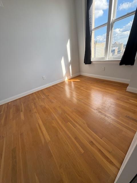 32 Peachtree Street Northwest, Unit 1506 Atlanta, GA 30303 - Photo 16 of 41 a view of empty room with window and fireplace