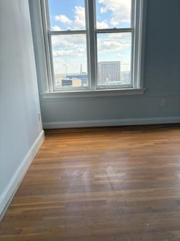 32 Peachtree Street Northwest, Unit 1506 Atlanta, GA 30303 - Photo 21 of 41 wooden floor in an empty room with a window