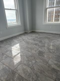 32 Peachtree Street Northwest, Unit 1506 Atlanta, GA 30303 - Photo 27 of 41 an empty room with windows