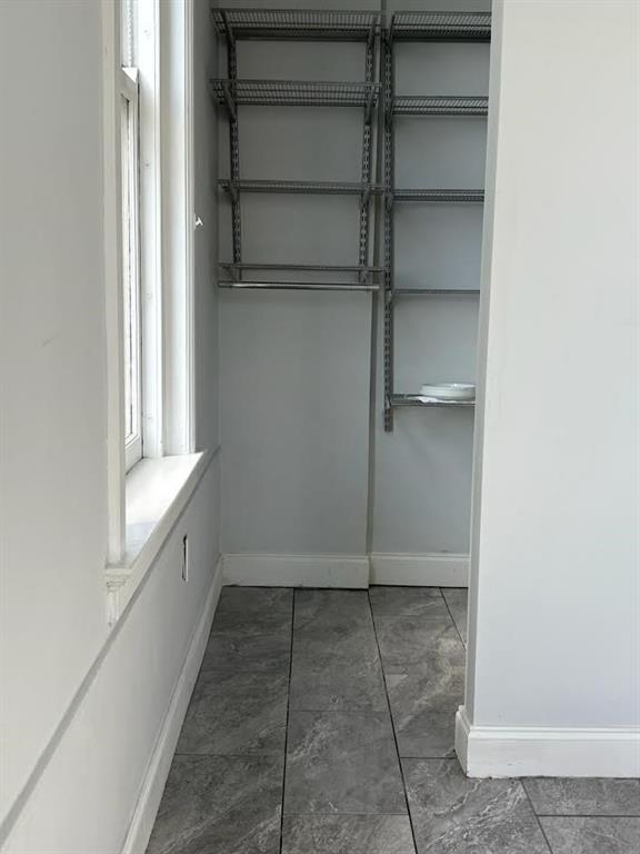 32 Peachtree Street Northwest, Unit 1506 Atlanta, GA 30303 - Photo 31 of 41 a view of an empty walk in closet