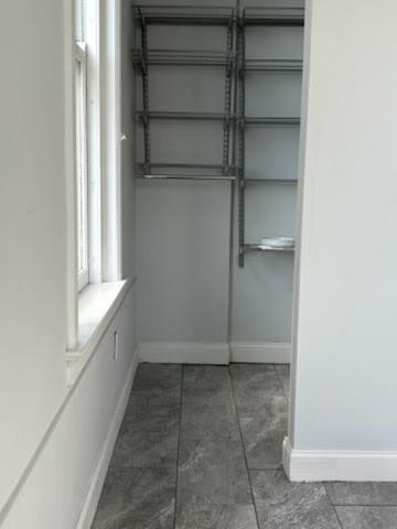 32 Peachtree Street Northwest, Unit 1506 Atlanta, GA 30303 - Photo 36 of 41 a view of an empty walk in closet