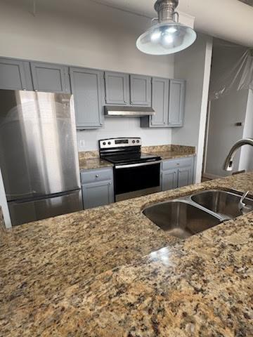 32 Peachtree Street Northwest, Unit 1506 Atlanta, GA 30303 - Photo 4 of 41 a kitchen with granite countertop a refrigerator and a sink