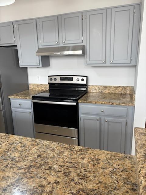 32 Peachtree Street Northwest, Unit 1506 Atlanta, GA 30303 - Photo 5 of 41 a kitchen with a stove and cabinets