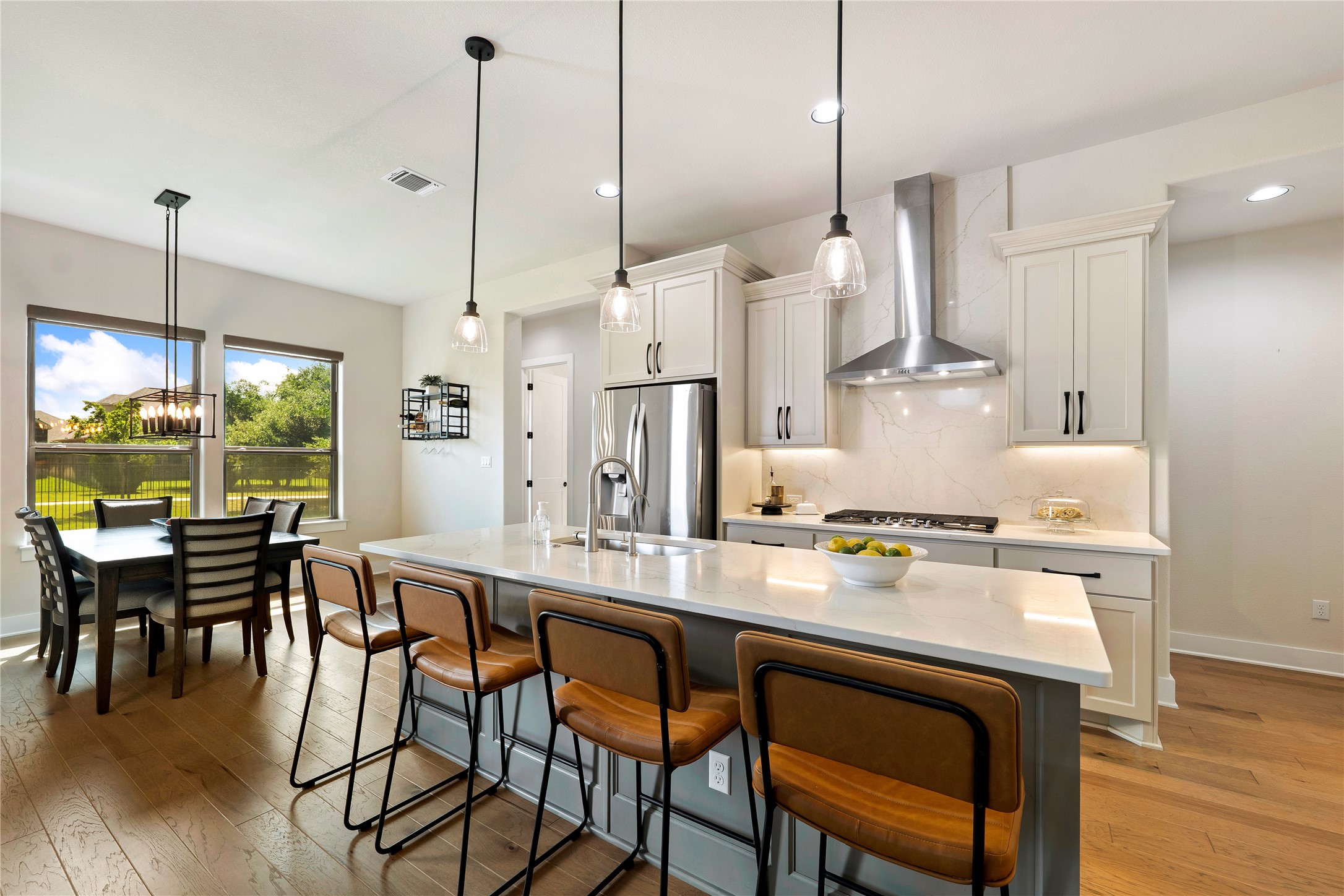 2408 Nate's Place Georgetown, TX 78633 - Photo 10 of 40 Culinary creations come alive in this meticulously appointed kitchen featuring an expansive central island and premium appliances.