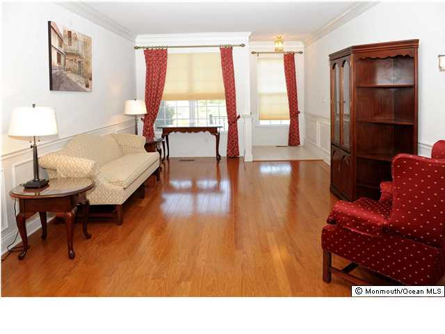94 Brookfield Drive Jackson, NJ 08527 - Photo 2 of 3 a living room with furniture and a window