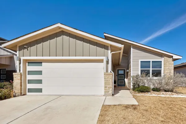 a view of house with garage