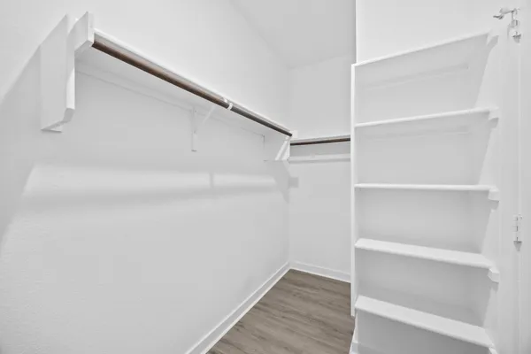 a view of an empty walk in closet