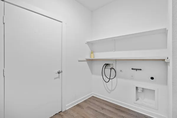 a picture of white wall with cabinet