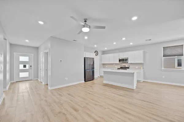 a view of kitchen with cabinets
