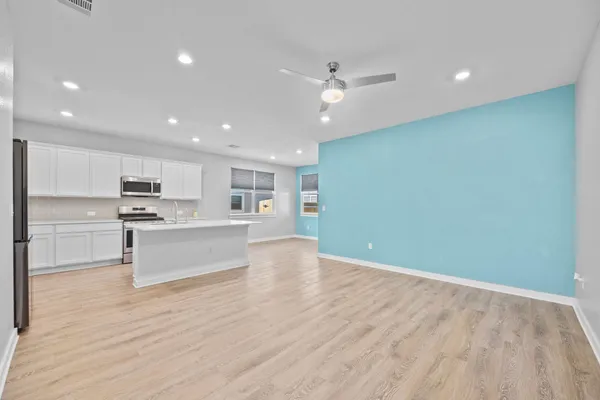 a view of kitchen with wooden floor