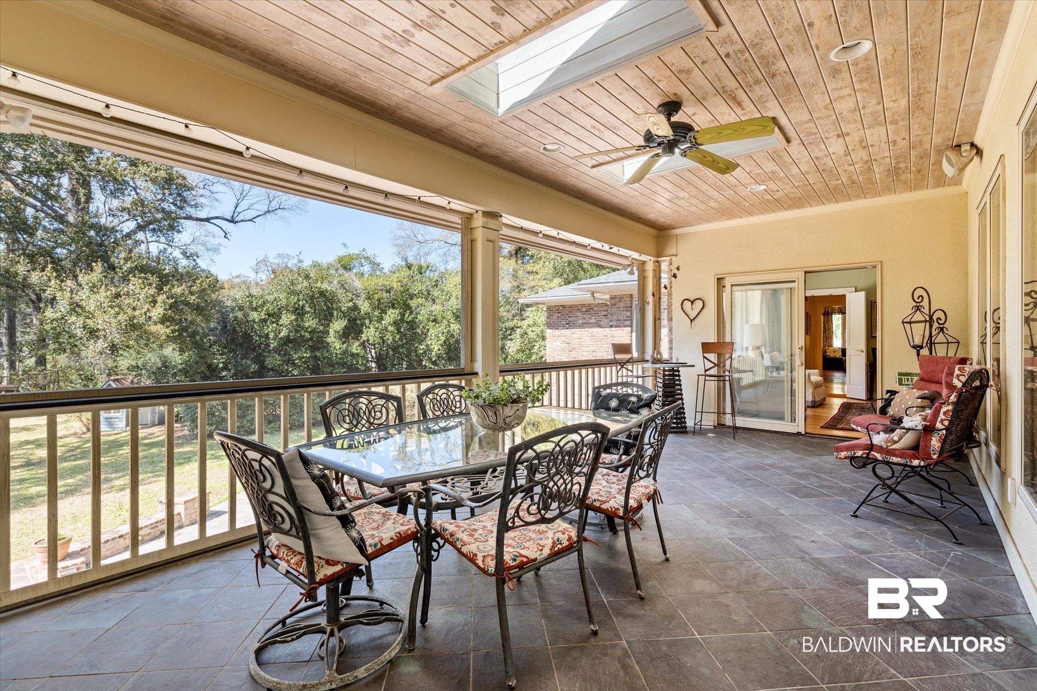 4 Kingsway Mobile, AL 36608 - Photo 17 of 44 Sunroom with a skylight, wood ceiling, and ceiling fan