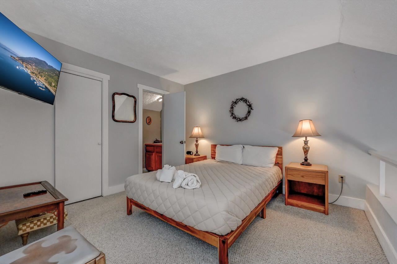 116 Snow Ridge Cir Lake Lake Harmony, PA 18624 - Photo 47 of 66 a bedroom with a bed and a lamp on table