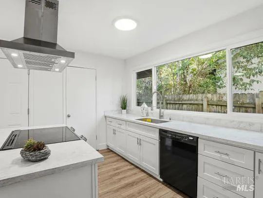 a kitchen with a sink and large window