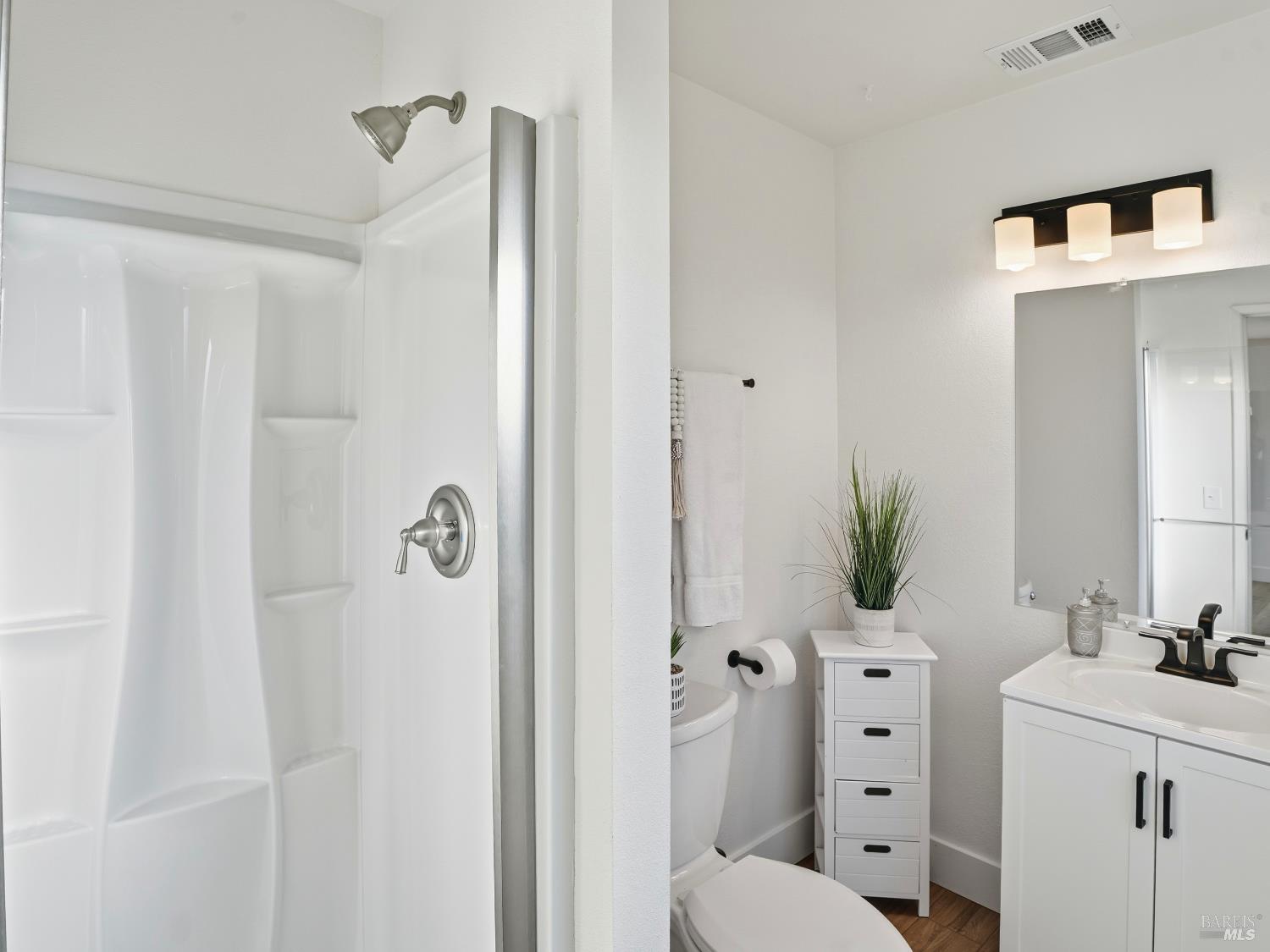 6041 Evelyn Avenue Rohnert Park, CA 94928 - Photo 21 of 37 a bathroom with a sink vanity granite and shower
