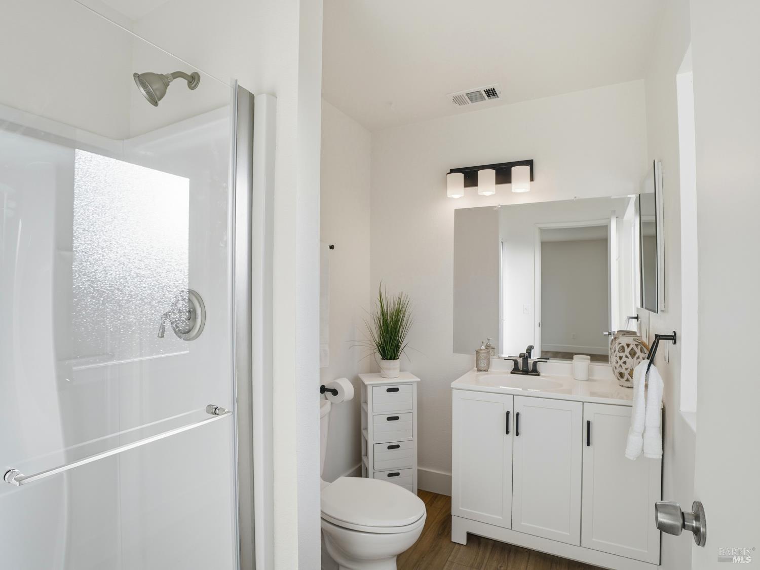 6041 Evelyn Avenue Rohnert Park, CA 94928 - Photo 22 of 37 a bathroom with a sink a toilet and shower