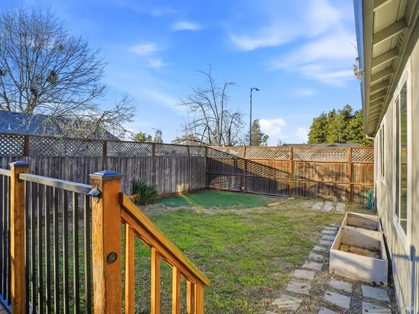 a view of a backyard with sitting area