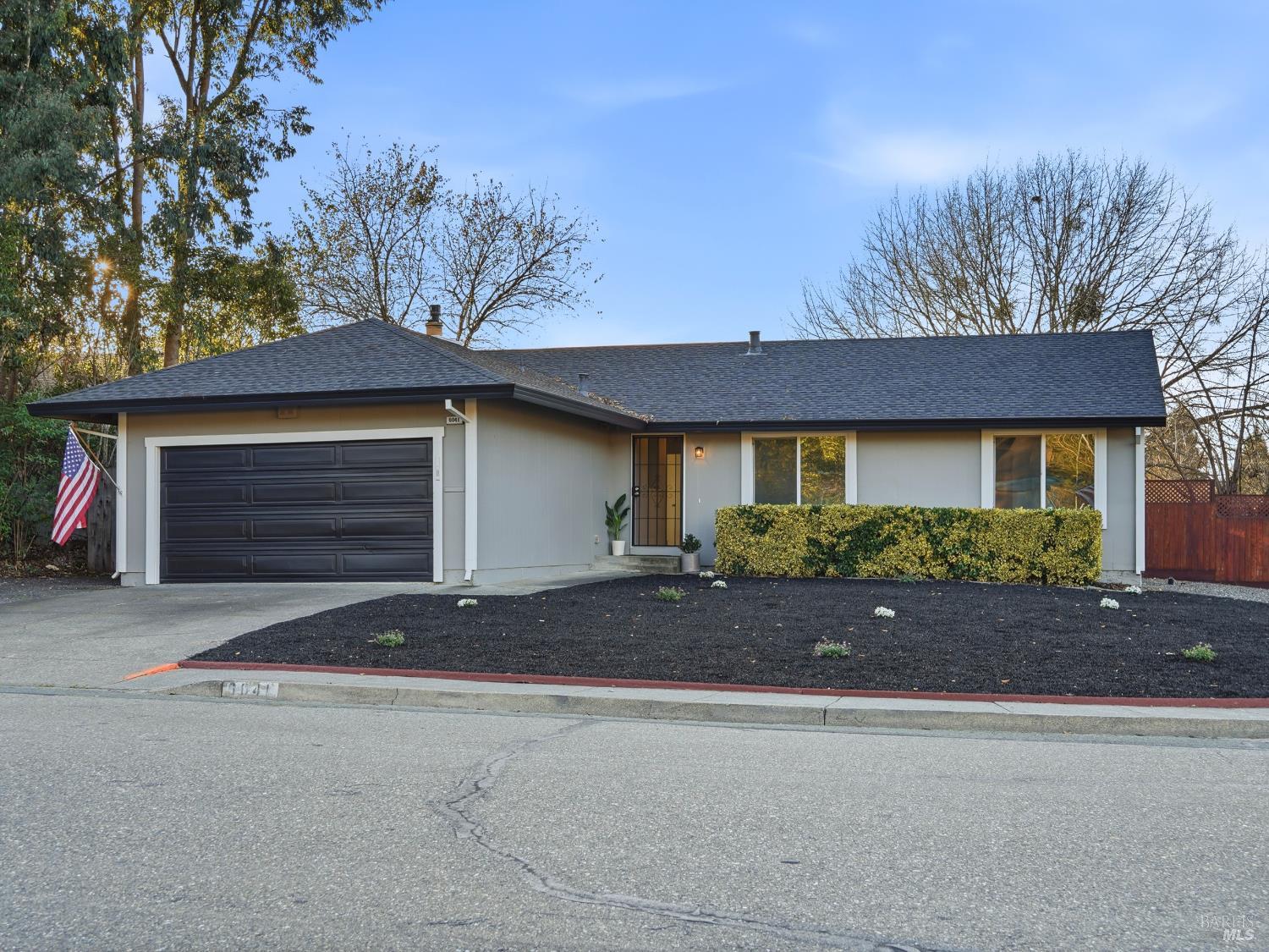 6041 Evelyn Avenue Rohnert Park, CA 94928 - Photo 35 of 37 a front view of house with yard and trees in the background