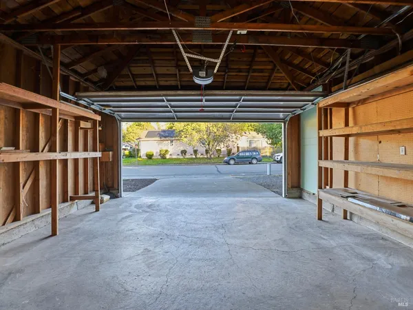 a view of an empty room with wooden walls