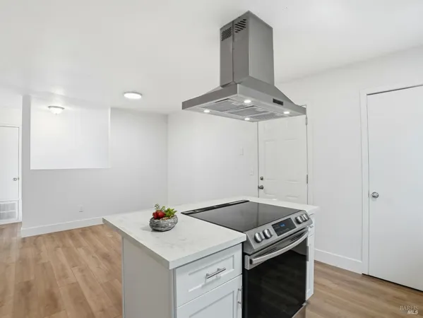 a kitchen with a stove and a sink