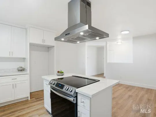 a kitchen with a stove and a refrigerator
